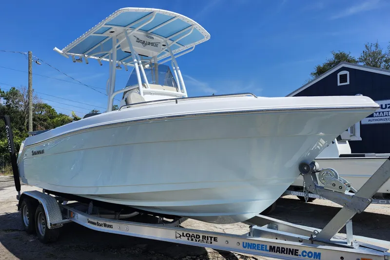 The Image of 2026 Savannah 2200 Offshore boat on trailer under clear blue sky. - 1