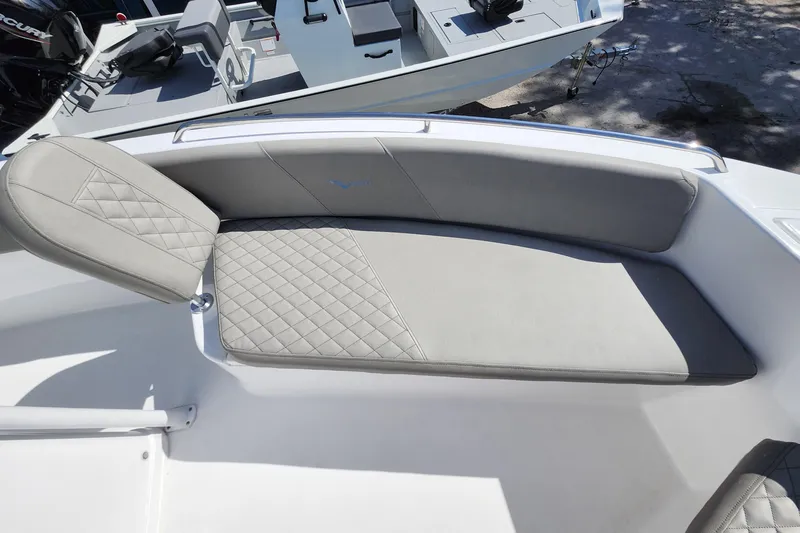 Slide: The Image of Luxurious seating on 2026 Savannah 2200 Offshore boat, featuring quilted gray upholstery. - 13
