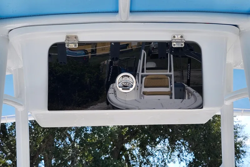 Slide: The Image of 2026 Savannah 2200 Offshore boat console with reflection, featuring sleek design and secure latch. - 18