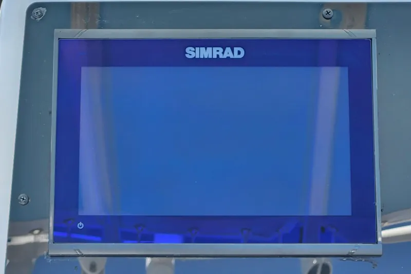 Slide: The Image of Simrad display screen on 2026 Savannah 2200 Offshore boat dashboard. - 21