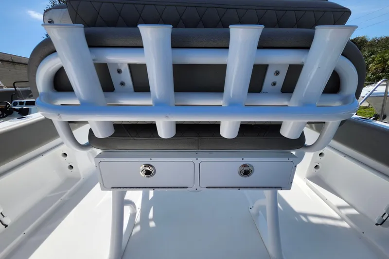 Slide: The Image of 2026 Savannah 2200 Offshore boat seat with rod holders and storage drawers. - 33