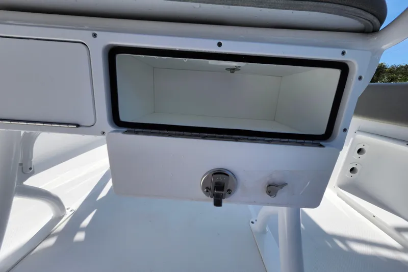Slide: The Image of Storage compartment on a 2026 Savannah 2200 Offshore boat, featuring a sleek white interior. - 34