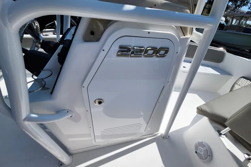 Slide: The Image of 2026 Savannah 2200 Offshore boat interior with steering wheel and seating. - 36