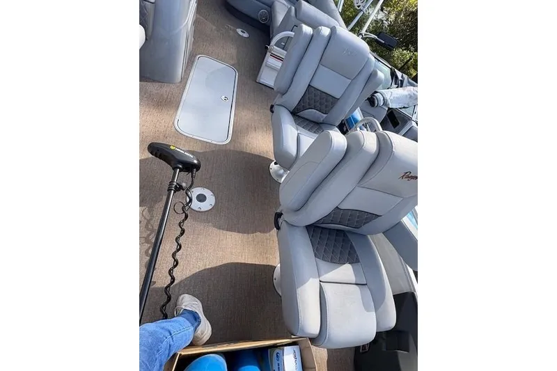 Slide: The Image of 2021 Ranger Reata 223FC boat interior with plush seating and modern design. - 12