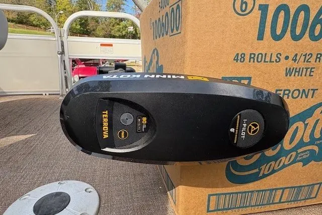 Slide: The Image of Minn Kota Terrova motor on 2021 Ranger Reata 223FC boat, next to a box of paper towels. - 14