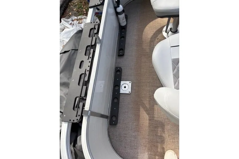 Slide: The Image of 2021 Ranger Reata 223FC boat interior with seating and storage compartments. - 15