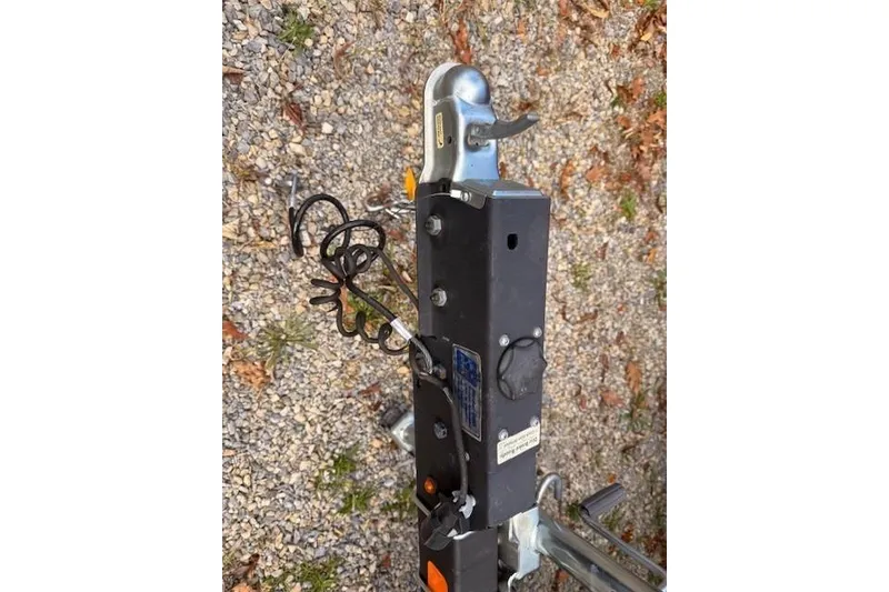 Slide: The Image of Trailer hitch of 2021 Ranger Reata 223FC on gravel surface. - 17