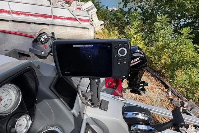 Slide: The Image of 2021 Ranger Reata 223FC boat dashboard with Humminbird fish finder and Mercury engine. - 7