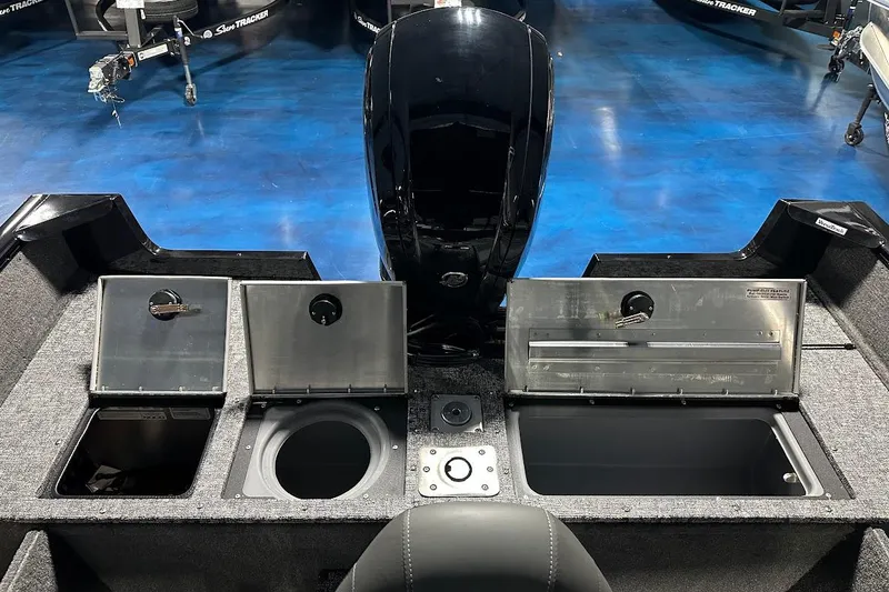Slide: The Image of 2026 Tracker Pro Guide V-175 WT boat interior with storage compartments and motor. - 12