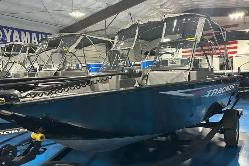 The Image of 2026 Tracker Pro Guide V-175 WT boat displayed indoors on a trailer. - 2