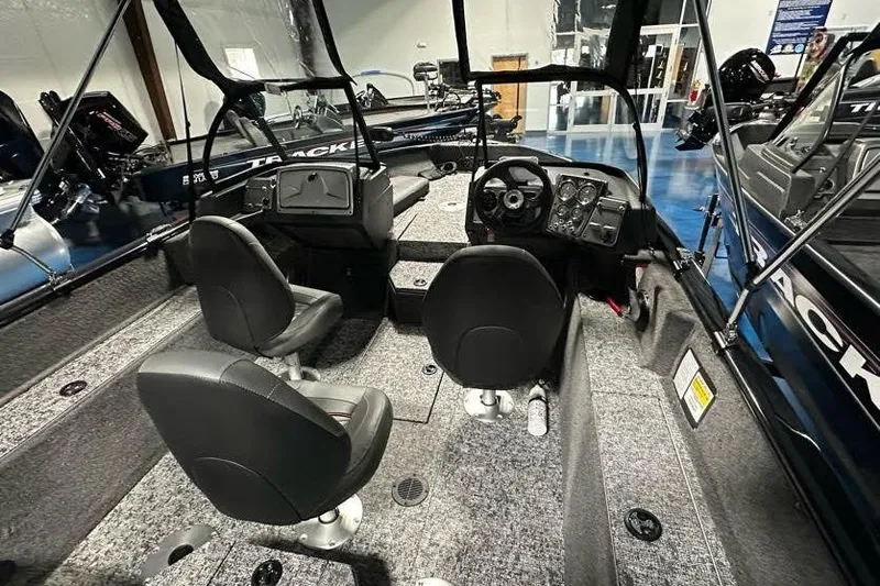 Slide: The Image of 2026 Tracker Pro Guide V-175 WT boat interior with dual seats and control panel. - 8