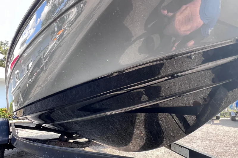 Slide: The Image of 2015 Yamaha Boats SX192 hull reflecting surroundings, parked on a trailer. - 10