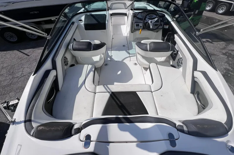 Slide: The Image of 2015 Yamaha Boats SX192 interior with seating and steering wheel, showcasing spacious design. - 13