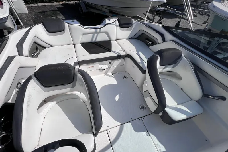 Slide: The Image of 2015 Yamaha Boats SX192 interior with white and black seating arrangement. - 14