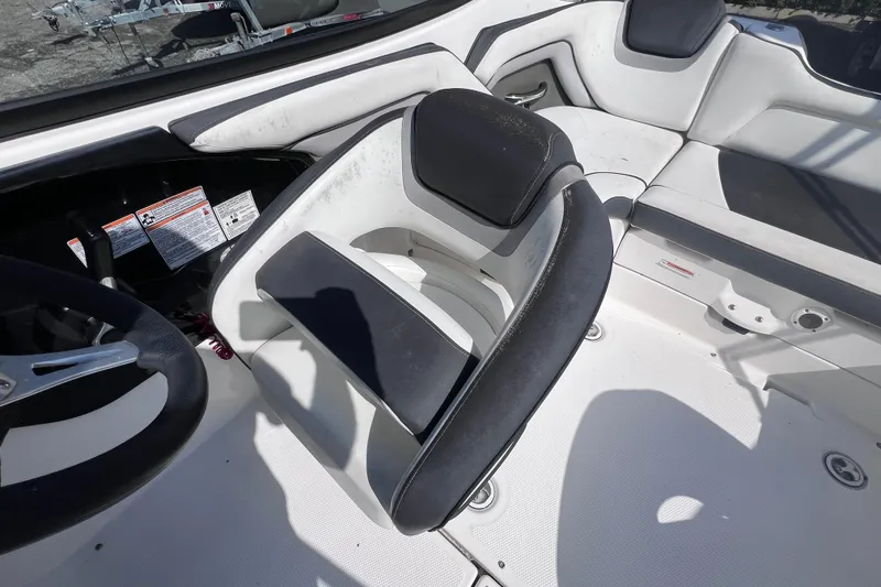 Slide: The Image of 2015 Yamaha Boats SX192 interior with steering wheel and seating area. - 16