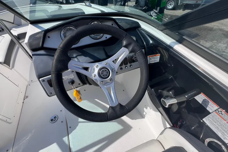 Slide: The Image of 2015 Yamaha Boats SX192 steering wheel and dashboard interior view. - 17