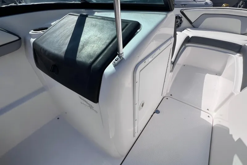 Slide: The Image of 2015 Yamaha Boats SX192 interior with seating and storage compartment. - 18