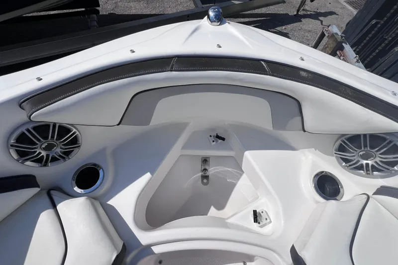 Slide: The Image of 2015 Yamaha Boats SX192 interior with speakers and cup holders. - 22