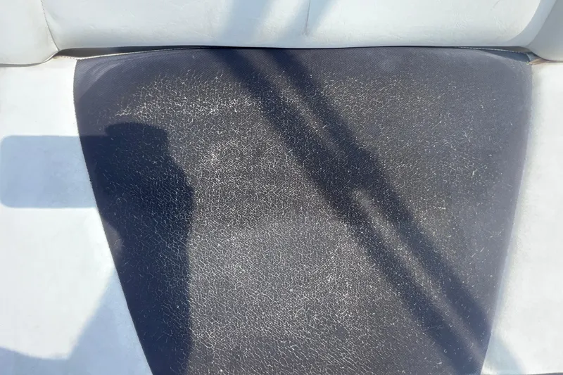 Slide: The Image of 2015 Yamaha Boats SX192 seat with visible wear and shadow. - 25