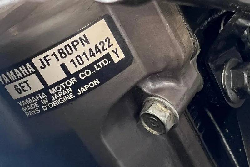 Slide: The Image of Close-up of Yamaha SX192 engine label, model JF180PN, made in Japan, 2015. - 29