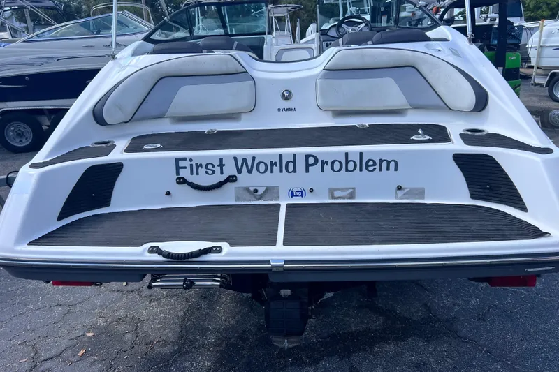 Slide: The Image of 2015 Yamaha Boats SX192 with "First World Problem" text on the stern, docked in a marina. - 3