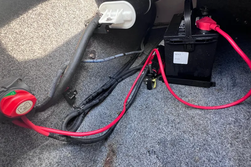 Slide: The Image of 2015 Yamaha SX192 boat battery setup with red cables and switch. - 30