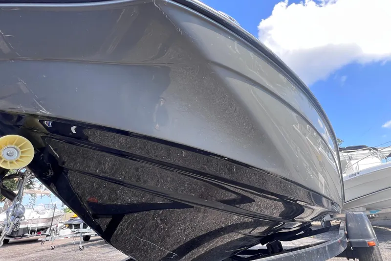 Slide: The Image of 2015 Yamaha Boats SX192 hull close-up under blue sky. - 9