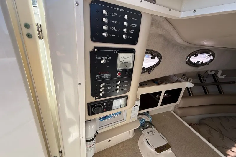 Slide: The Image of 2003 Hydra-Sports Vector 2800 WA cabin interior with control panel and seating area. - 16