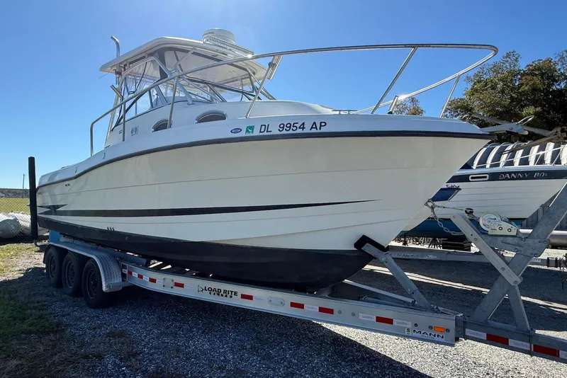 Slide: The Image of 2003 Hydra-Sports Vector 2800 WA boat on trailer, parked outdoors. - 2