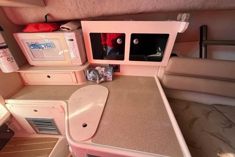 Slide: The Image of 2003 Hydra-Sports Vector 2800 WA cabin interior with kitchenette and storage. - 21