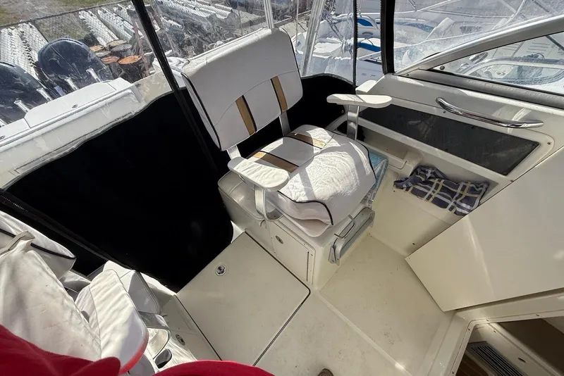 Slide: The Image of 2003 Hydra-Sports Vector 2800 WA boat interior with cushioned seating and helm area. - 6