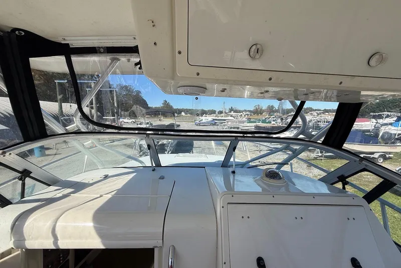 Slide: The Image of 2003 Hydra-Sports Vector 2800 WA boat interior view with windshield and dashboard. - 7