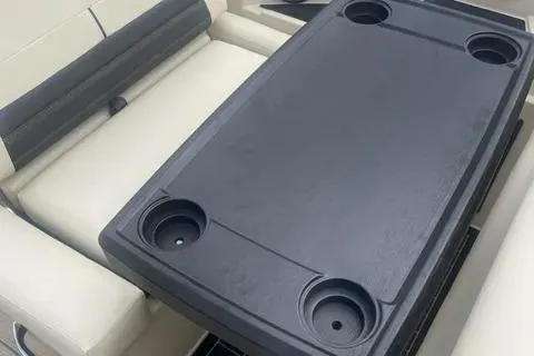 Slide: The Image of 2024 Sylvan G-3 DLZ DC boat interior with table and cup holders. - 10