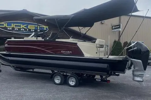 Slide: The Image of 2024 Sylvan G-3 DLZ DC pontoon boat on trailer at dealership. - 12