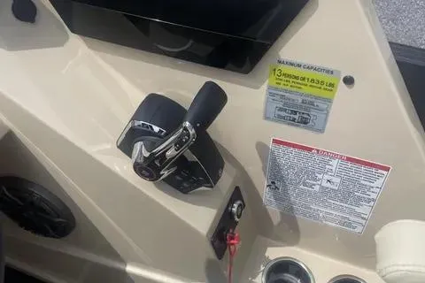 Slide: The Image of 2024 Sylvan G-3 DLZ DC boat control panel with throttle and capacity labels. - 3