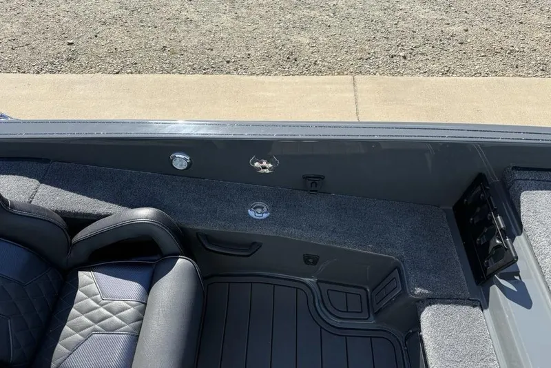 Slide: The Image of Interior of 2026 Phoenix 920 Elite X boat with sleek seating and storage compartments. - 12