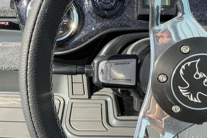Slide: The Image of Steering wheel and controls of 2026 Phoenix 920 Elite X boat. - 19