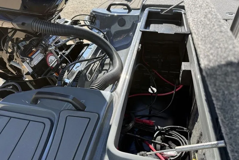 Slide: The Image of Open compartment of 2026 Phoenix 920 Elite X boat showing engine and wiring. - 32
