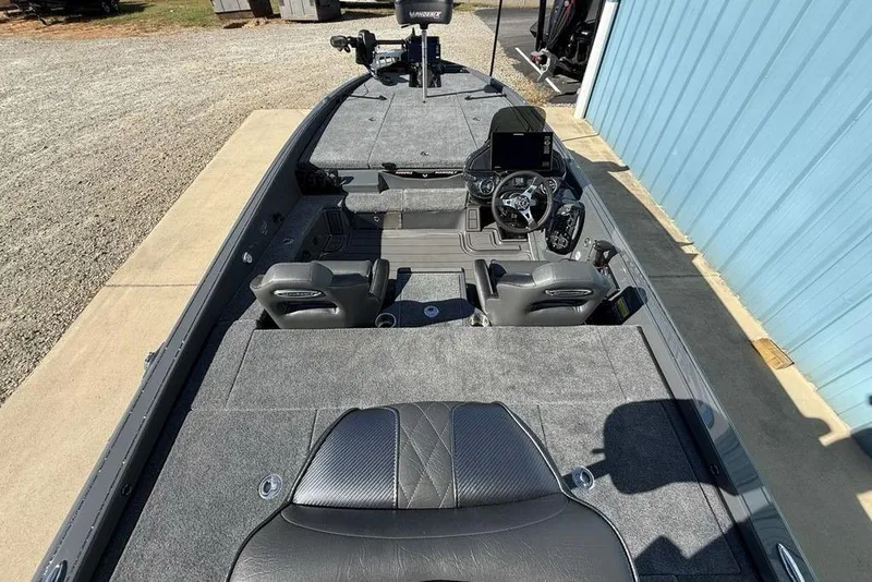 Slide: The Image of 2026 Phoenix 920 Elite X boat interior with modern dashboard and seating. - 33