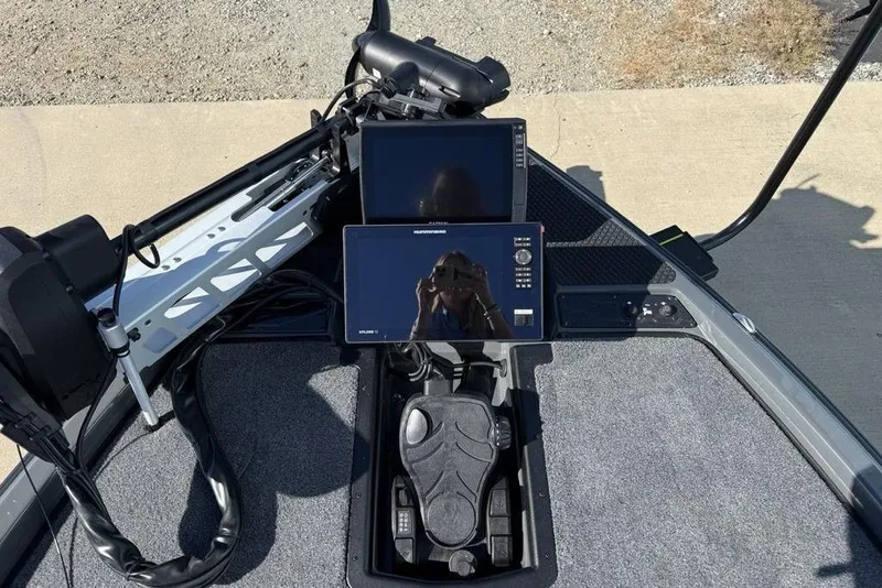 Slide: The Image of 2026 Phoenix 920 Elite X boat dashboard with advanced navigation screens and controls. - 7