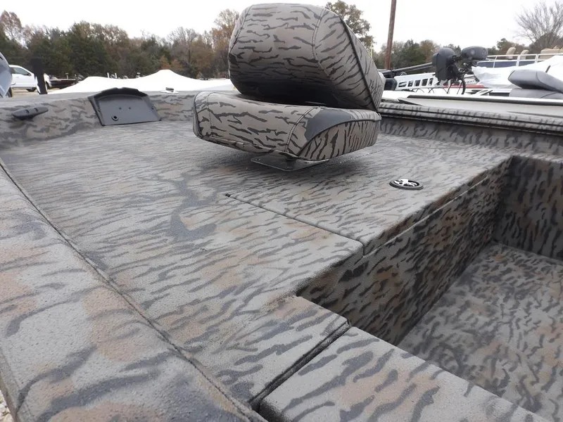 Slide: The Image of 2019 Xpress XP180 boat with camouflage interior design and seating. - 9