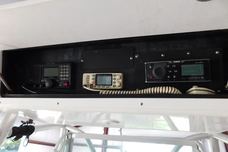 Slide: The Image of 2003 Regulator 32 Center Console electronics panel with communication and audio systems. - 39