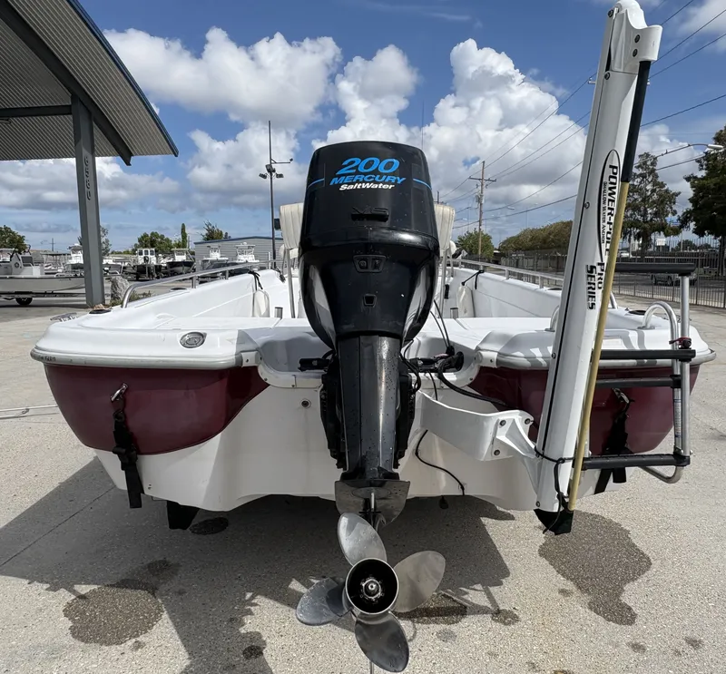 Slide: The Image of Fishmaster 23 boat, 2000 model, with Mercury 200 Saltwater engine, docked outdoors. - 3