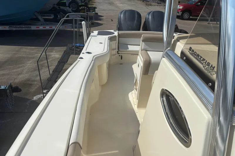 Slide: The Image of 2006 Scout 282 Sportfish boat interior with dual engines and seating area. - 12
