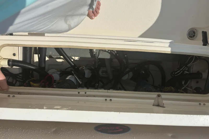 Slide: The Image of Open hatch of 2006 Scout 282 Sportfish boat showing internal wiring and components. - 13