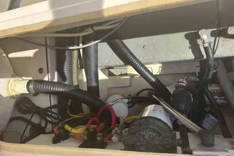 Slide: The Image of 2006 Scout 282 Sportfish engine compartment with wiring and mechanical components. - 15