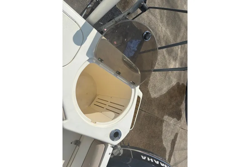 Slide: The Image of Open storage compartment on 2006 Scout 282 Sportfish boat, with Yamaha engine visible. - 17