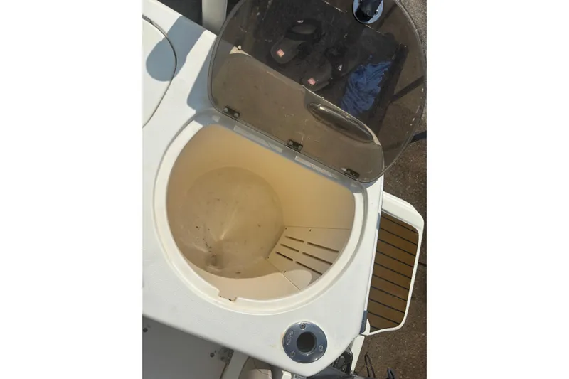 Slide: The Image of Open storage compartment on 2006 Scout 282 Sportfish boat. - 18