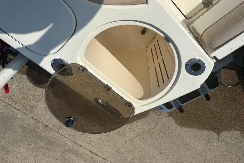 Slide: The Image of Open storage compartment on a 2006 Scout 282 Sportfish boat, showing interior details. - 19