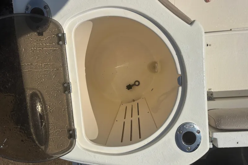 Slide: The Image of Open storage compartment on a 2006 Scout 282 Sportfish boat. - 20